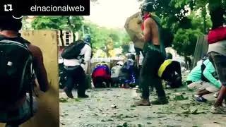 Caracas Venezuela GNB fighting the people #FreeVenezuela