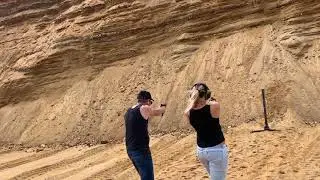 Hot blonde chick Shooting the Dueling Tree