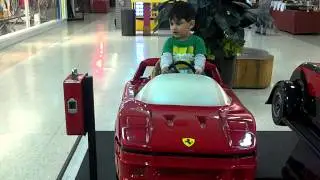Parsa riding a race car