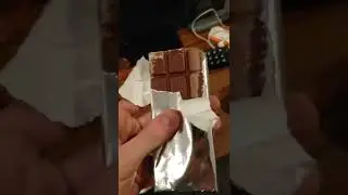 Eating a 1 year old Hatsune Miku Chocolate bar.