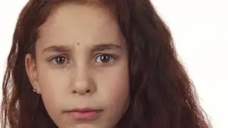 A Little Girl Brings a Finger To Her Mouth and Asks for Silence | Stock Footage - Videohive