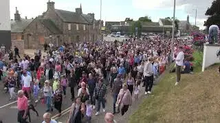 A tradition returns as the massed pipe bands march down to the Highland Games from Viewfield