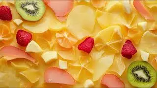 abstract fresh background pieces slices of different fruits top view