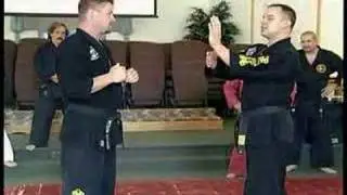 Master Drew Serrano teaching a block