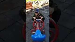 Handsome cute 5 year old boy is driving on playground. #drivinggames #driver #drivingtest