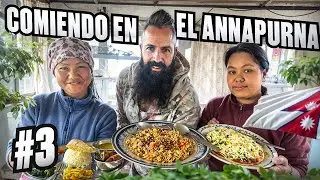 EATING AT THE BASE OF THE ANNAPURNA IN THE HIMALAYAS