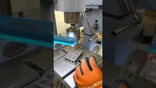 The process of making a precise hole for the handle screws