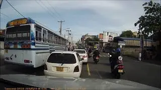 Bus driver running a red light 