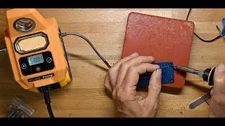 C.K. tries a soldering iron from Wisehigh powered by a Dewalt tool battery