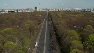 AERIAL: Strasse des 17. Juni with Pan up to reveal Brandenburg Gate in Berlin, Germany on Sunny Day
