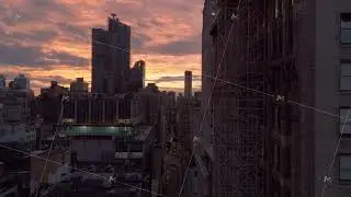 Aerial views capture a vibrant New York City street at sunset, with cars weaving through traffic