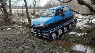 The tracked all-terrain vehicle carries firewood, pulls tractors, and drives off-road.