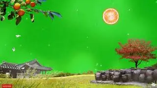 This lush green screen video of a small house, trees and particles in motion is stunning!