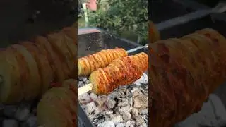 Potatoes with bacon on charcoal 😋😋😋