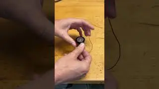 Light a bulb with a battery and one wire