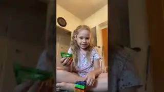 Hannah making a magnet toy pyramid