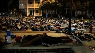 Car almost drives through protesters laying in Durham, NC street