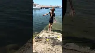 Woman Slips and Falls While Walking Into Water - 1506527
