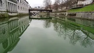 Ljubljana. Flight under bridges on river Ljubljanica. Dec. 2023