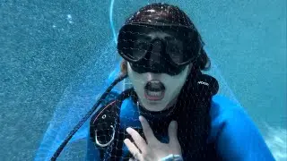 Scuba Girl Trapped Under Fishnet