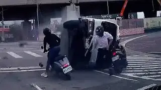 Truck topples over inches from motorcycle riders in Taiwan