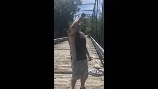 Drunk man front flips off top of bridge.
