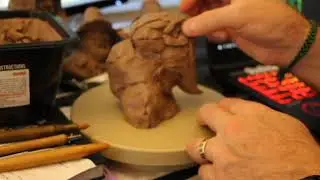 Me sculpting a hell hound to music.