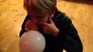 Elvis blows his balloon up with his nose