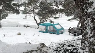 SNOW CAMPING IN A TENT WITH A WINTER GARDEN ON A FROZEN LAKE