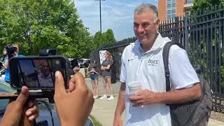 Coach Tom Walter boards the team bus as the Wake Forest baseball team heads to Omaha