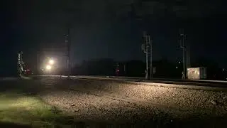 A BNSF Grain Train with a CN SD70M-2 duo pulling out of Springfield, MO