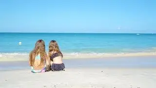 Adorable Little Girls Playing with Sand on the Beach | Stock Footage - Videohive