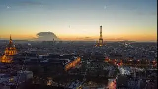 Day to Night Time Lapse over Paris with view of Eiffel Tower and Beautiful Sunset, Aerial Hyperlapse