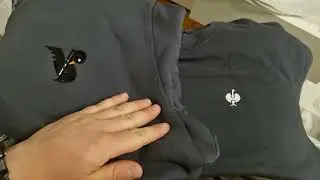 Logo embroidery on top of another logo.