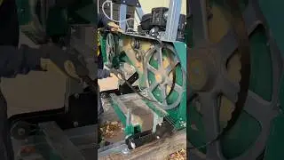 Changing to a fresh blade to mill a cedar pole 