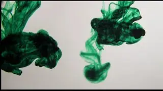 Texture Of Green Ink Moving In Water Container