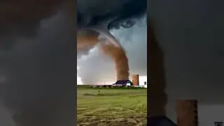 Tornado behind the farm  