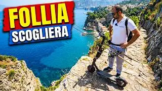 I go down a steep cliff with an electric scooter, spinning fishing in the sea in Sorrento