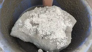 Whiteconcrete with reused cement huge soft chunks blocks crumbling in lots of water 💦 
