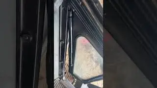 Газовый упор дверь мтз