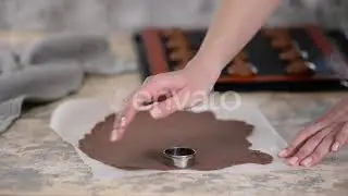 Woman Cutting Chocolate Shortcrust Dough Into Circles. Making Choux Buns with Craquelin | Stock ...