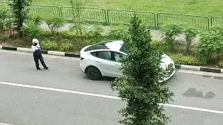TRAFFIC POLICE SUMMONS TESLA FOR ILLEGAL PARKING