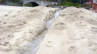 River Dam Breaks Into Ocean