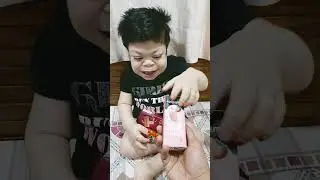 cute baby loves choclates and juices..