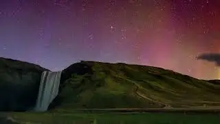 Northern lights dance  time-lapse on Skógafoss, Iceland