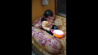 Kid Beating the Drum