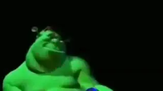 Early version of Shrek playing with a toy