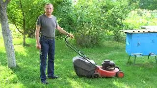 Mowing the grass with a lawn mower near beehives | Extreme beekeeping