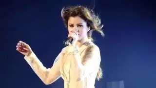 Selena Gomez gets emotional on stage while fans sing who says