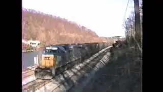 CSX & Seaboard power Q396, while a Chessie helper ties on at S. C-ville. 2/20/1990